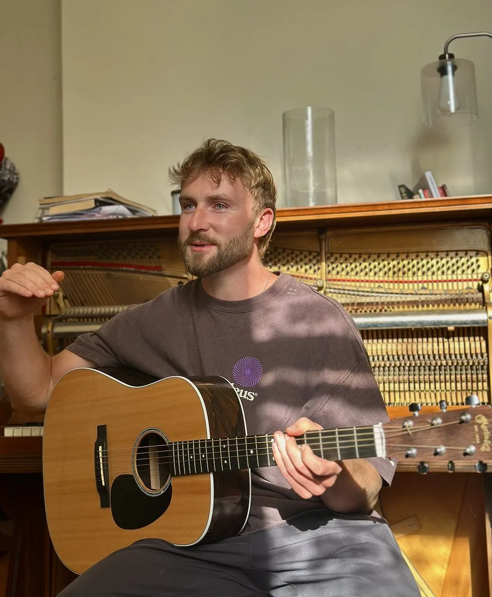 James McHugh playing guitar